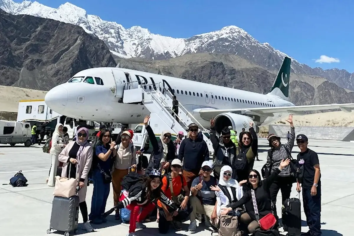 Aircraft approaching Skardu airport with Karakoram peaks behind, Gilgit-Baltistan