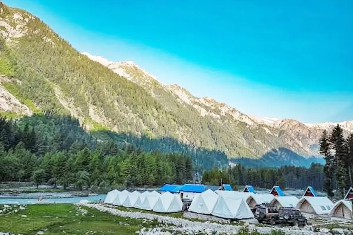Camping pods among deodar trees beside the Panjkora river, Kumrat
