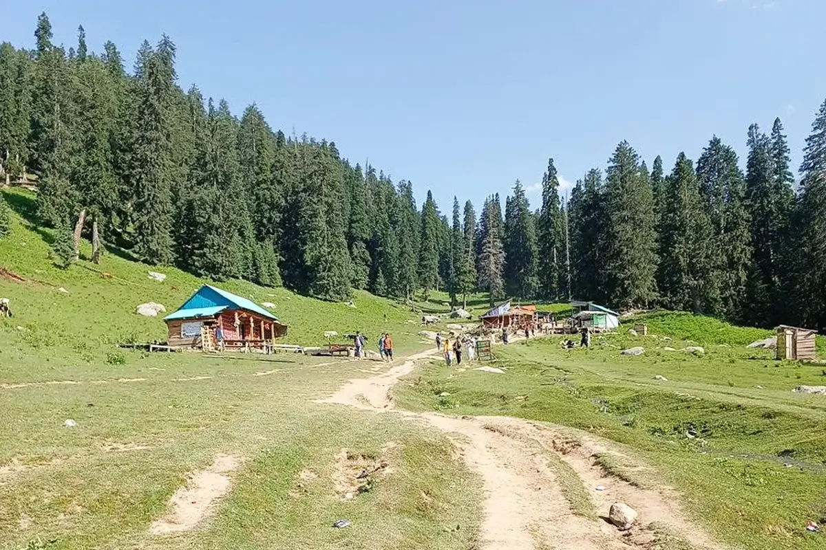 Hikers on the uphill trail from Thal to Jahaz Banda, Kumrat Valley
