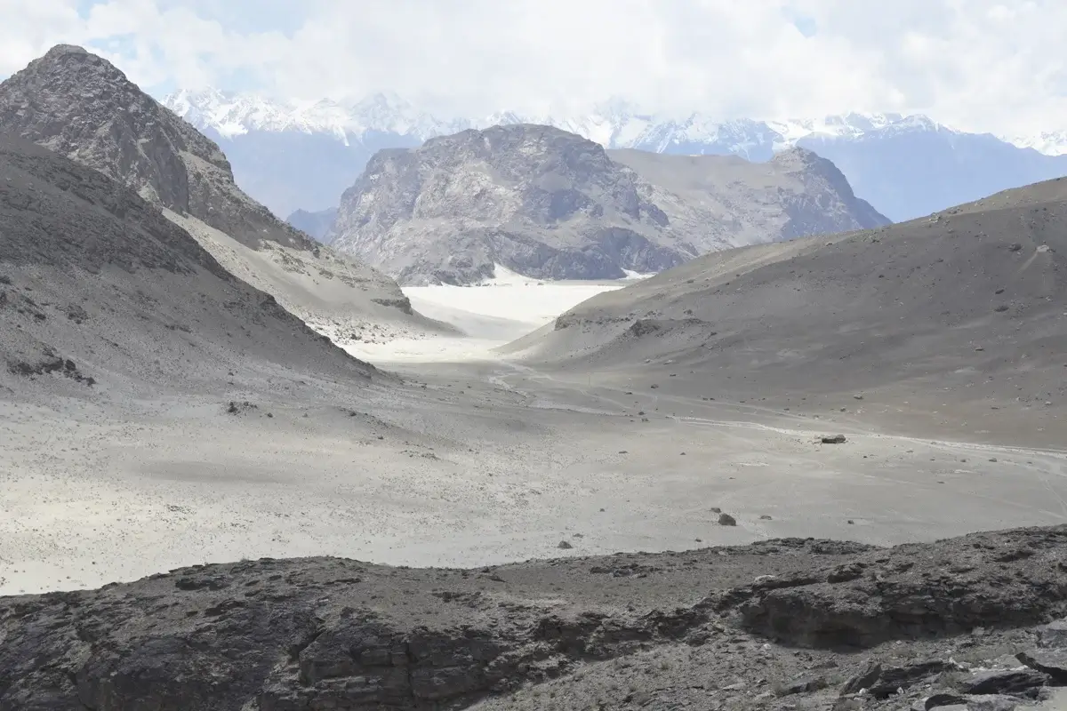 Katpana cold desert sand dunes with snow peaks behind, Skardu