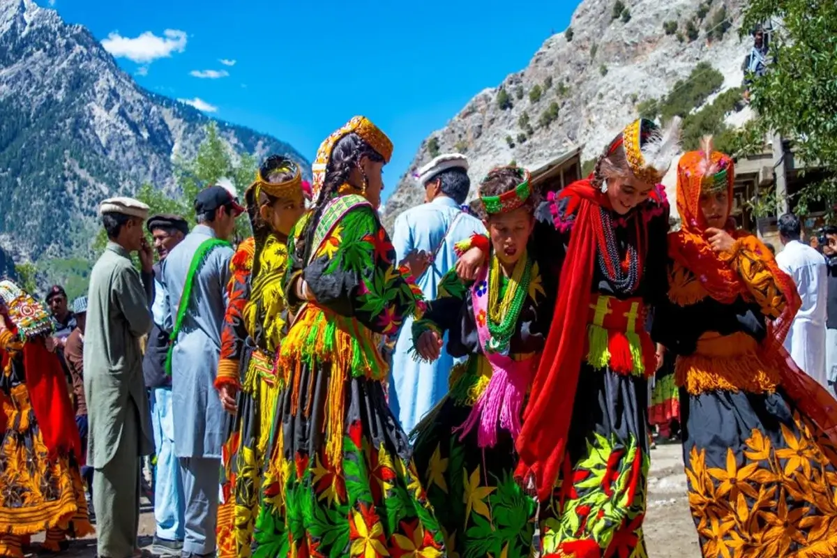 Kalasha people dancing during a festival in Bumburet valley, Chitral